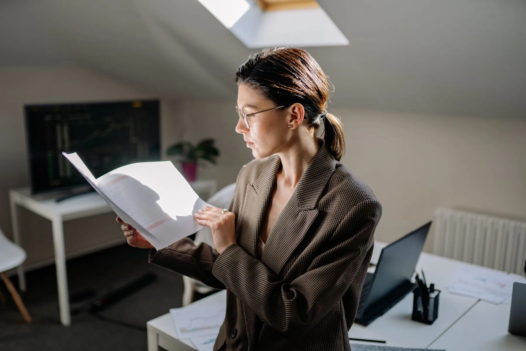 Property owner reviewing a monthly statement at a desk